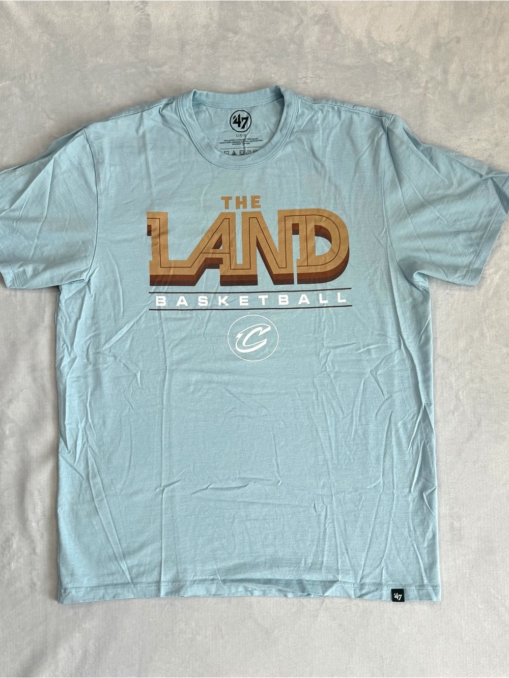 47 Brand Light Blue 'The Land' Basketball Tee with Brown Graphic